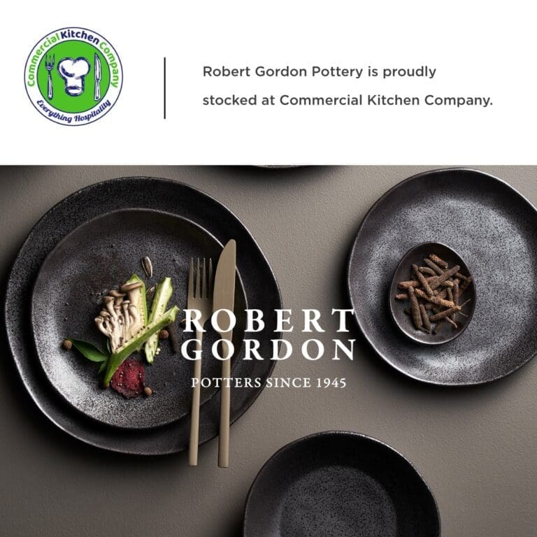 Elegant table setting featuring robert gordon pottery, showcasing sophisticated black plates with fine dining cutlery and artistically presented food – a proud offering from commercial kitchen company.
